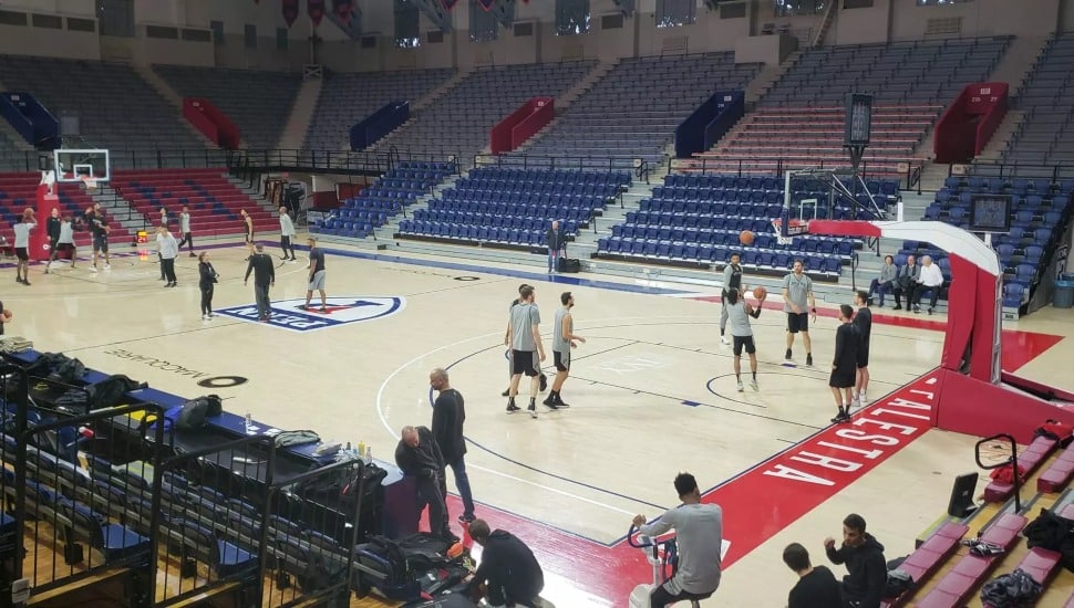 Players and the crowd inside Penn Athletics' Palestra.