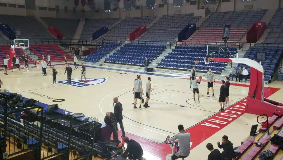 Players and the crowd inside Penn Athletics' Palestra.