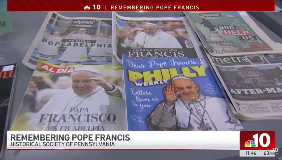 A collection of magazines and newspapers with Pope Francis' face on them.