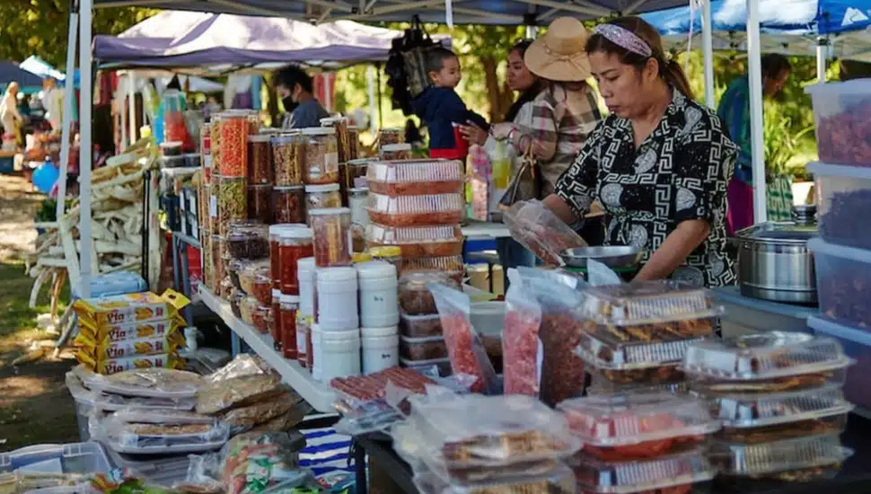 Vendors at the Southeast Asian Market with food.
