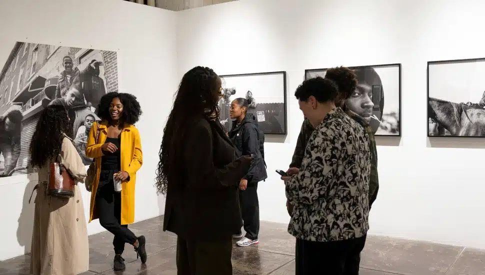 People enjoying a photo gallery inside TILT Institute for the Contemporary Image.