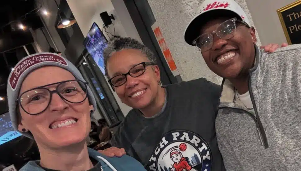 Jen Leary and two other women smiling while at a bar.