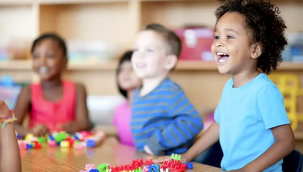Chlldren smiling.