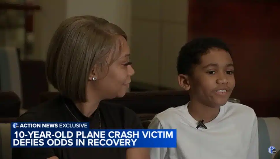 !0-year-old Andre Howard (right) smiles while his other proudly looks over at him (left).