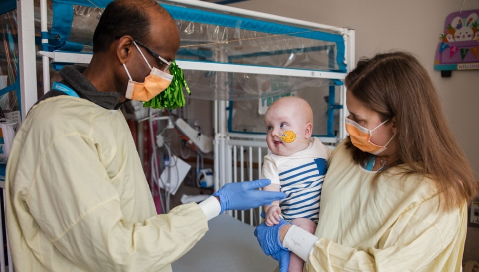 Rebecca Ahrens-Nicklas, MD, PhD, and Penn Medicine’s Kiran Musunuru, MD, PhD, visiting KJ at CHOP.
