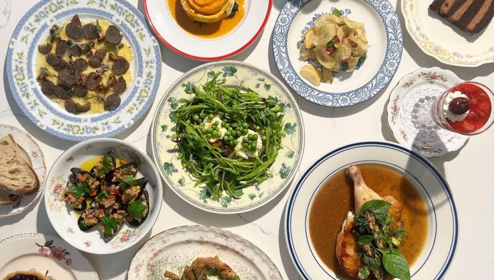 A table of entrees and desserts from Her Place Supper Club.