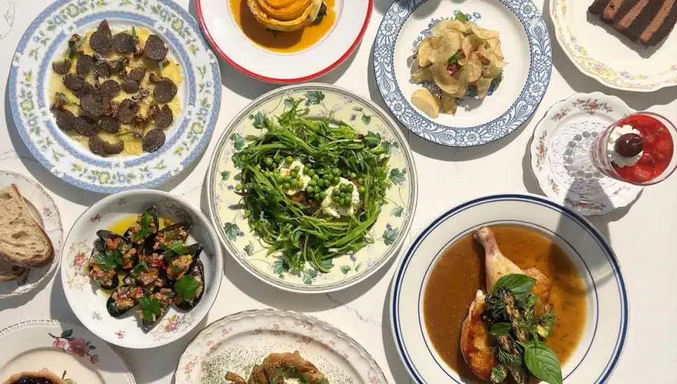 A table of entrees and desserts from Her Place Supper Club.