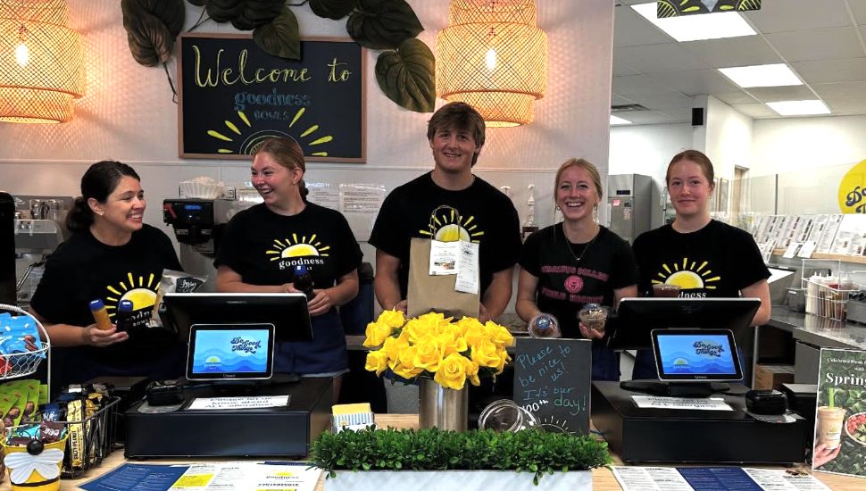 The team at Collegeville's Goodness Bowls stand behind the counter.