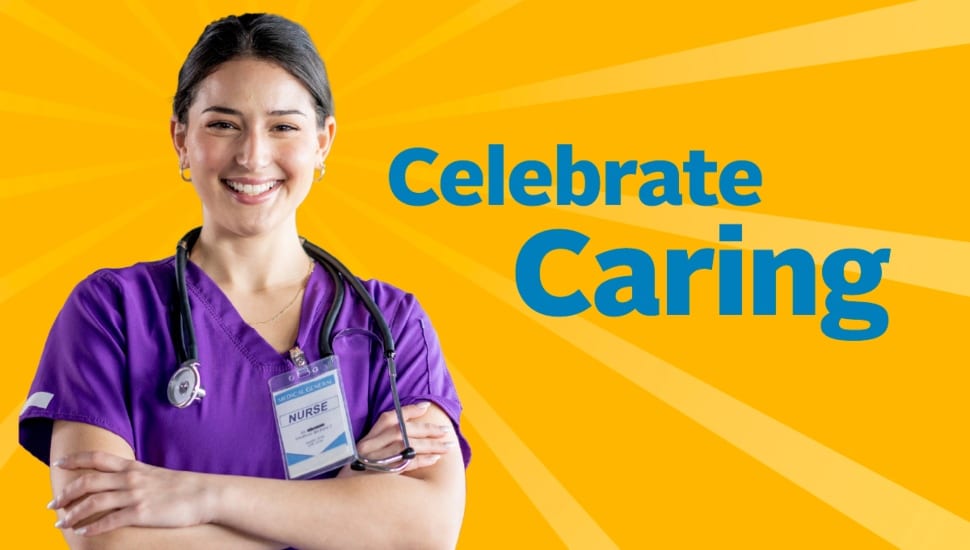 Female nurse in purple scrubs smiles in promotional campaign.