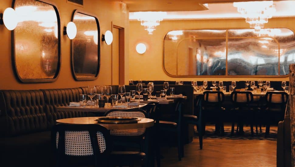 Interior of Jolene's restaurant with warm lighting and tables.