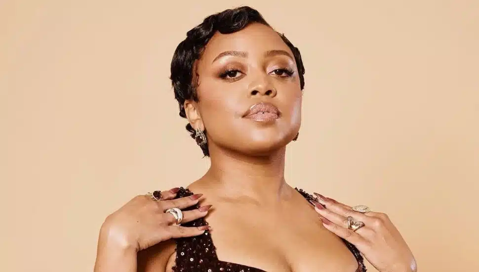 Quinta Brunson poses with hands on her shoulders.