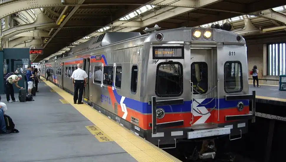 People on the platform waiting to enter into a Regional Rail.