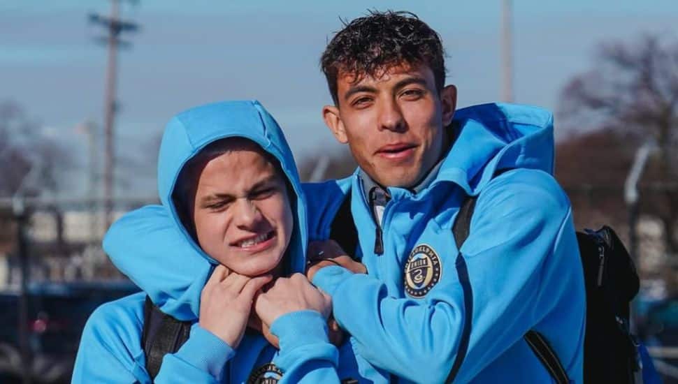 Quinn Sullivan wraps his arm around younger brother Cavan.