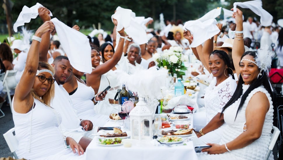 A group of people enjoying Diner en Blanc Philadelphia.
