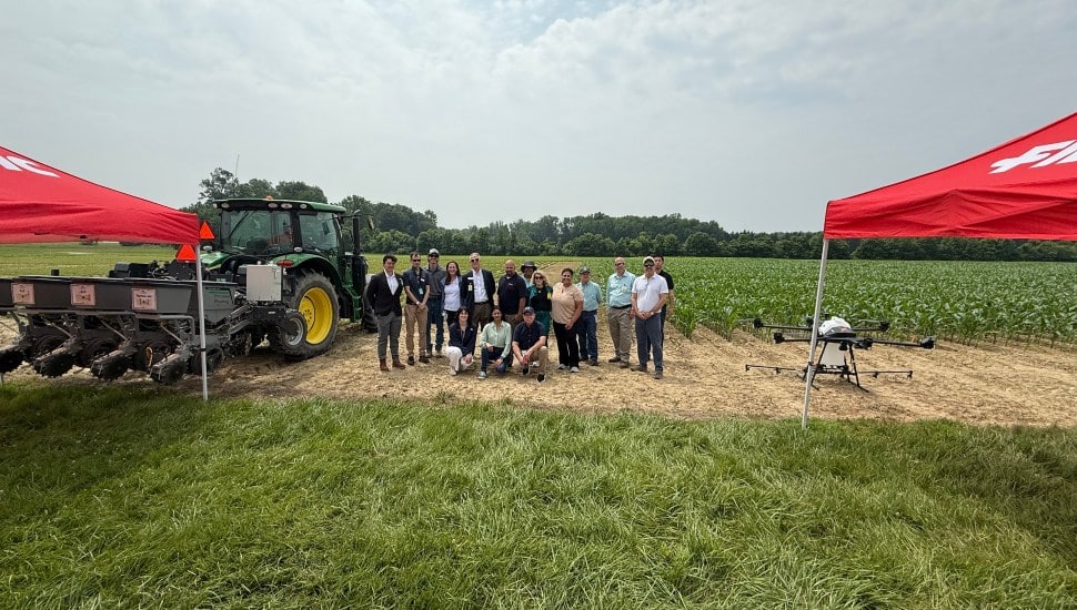 FMC Corporation representatives in a field.