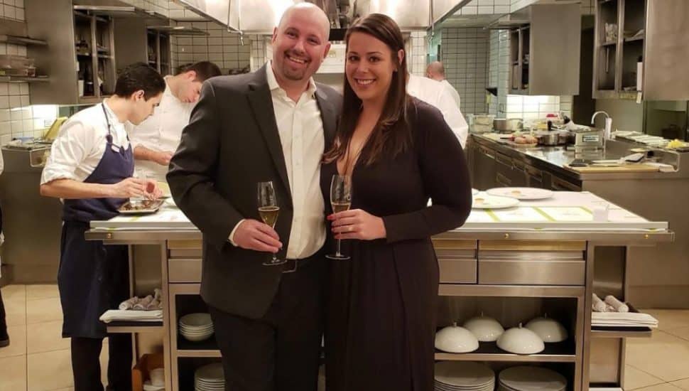 Kate and Philip Ferro smiling in a kitchen.