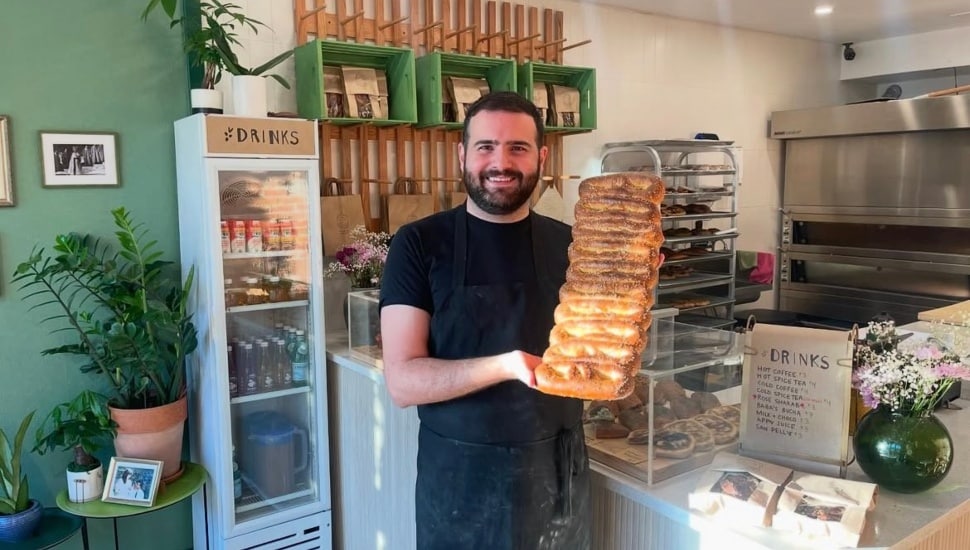 Kenan Rabah holding one of his delicious creations at Majdal Bakery.