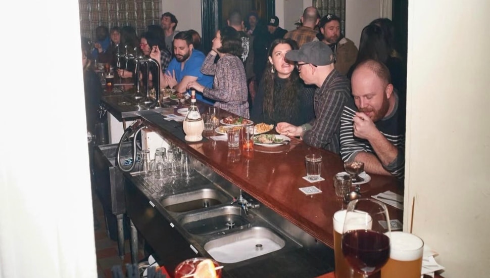People enjoying food, drinks, and vibes at Meetinghouse.