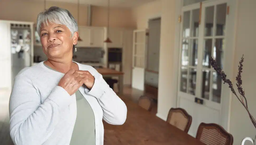 A senior woman inside her home.