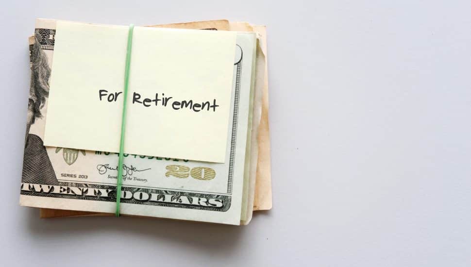 Dollars wrapped in a note that says "for retirement."