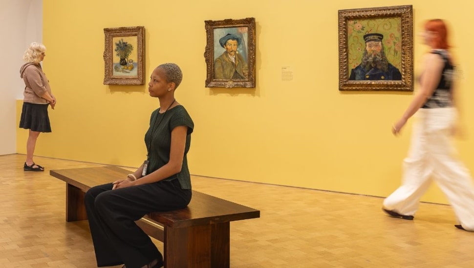 Visitors admire art work hanging on the walls of the Barnes Foundation.