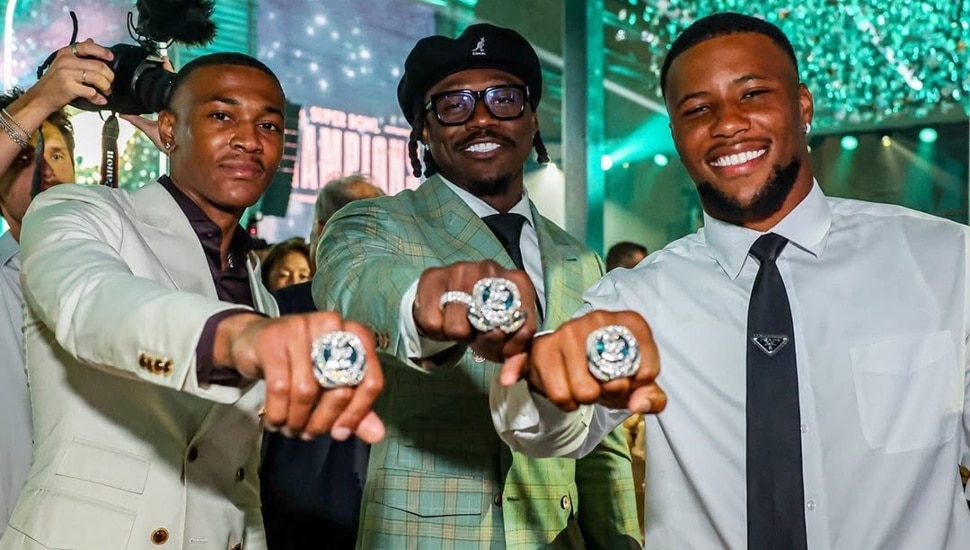 DeVonta Smith, AJ Brown, and Saquon Barkley showing off their Super Bowl rings.