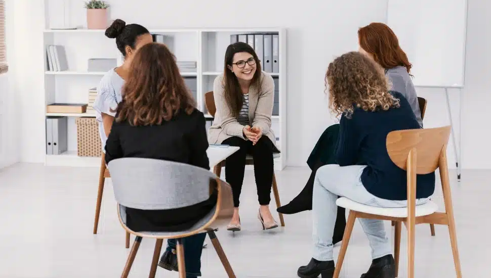 Women sitting and talking.