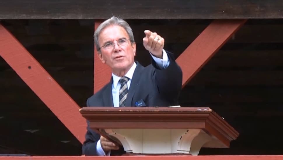 Chaplain Jack Crans preaching at a church service.