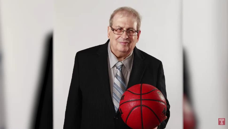 Mel Greenberg holding a basketball.