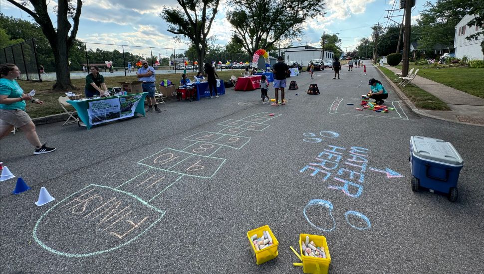 Hopscotch chalk, a water cooler and games at the Pottstown Regional Community Foundation's first Play Street Event.
