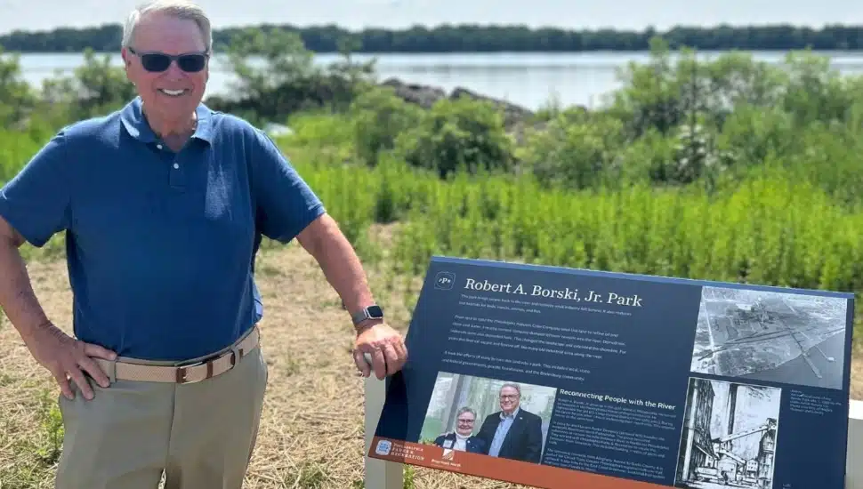 Robert A. Borski Jr. with a sign of the park named after him.