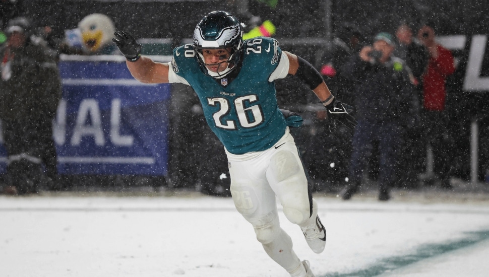 Philadelphia Eagles running back Saquon Barkley playing in a snow game.