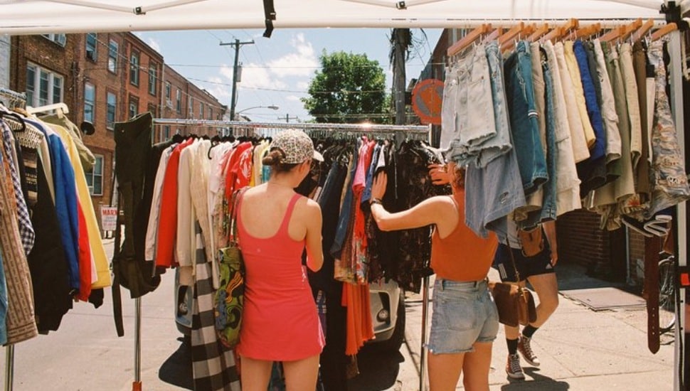 Two women shopping for vintage clothing.