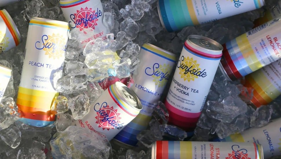 Multiple cans of Surfside placed on top of ice.