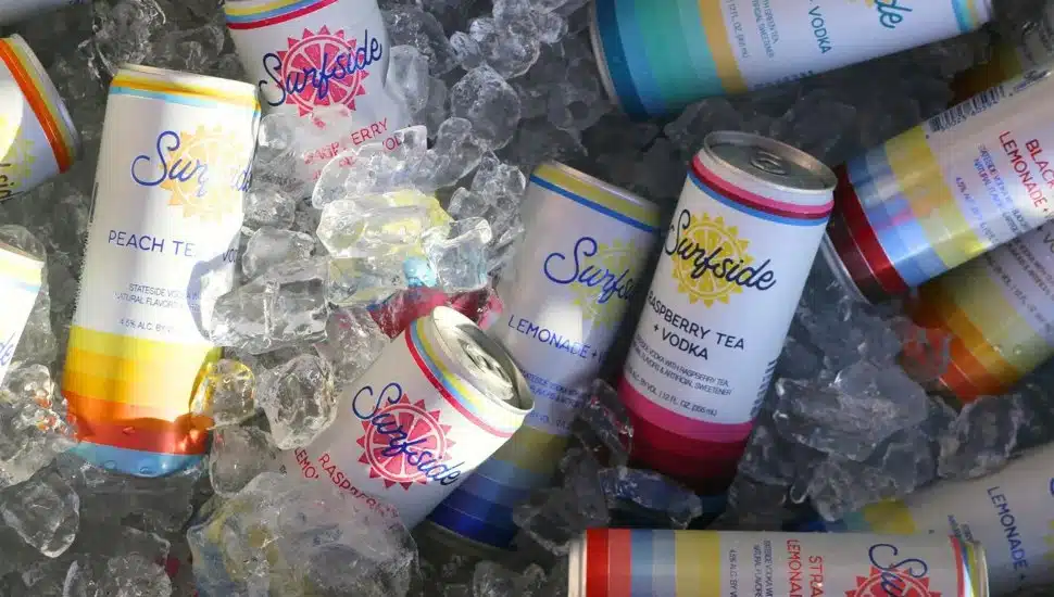 Multiple cans of Surfside placed on top of ice.