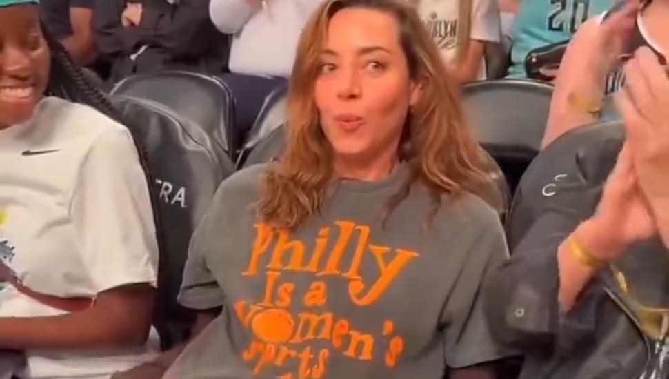 Aubrey Plaza enjoying a WNBA game at courtside.