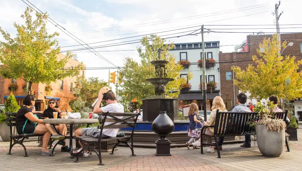 People hanging out near fountain in East Passyunk.