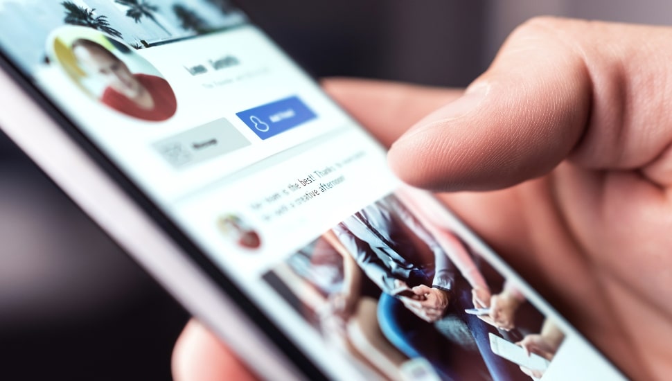 Man using LinkedIn his iPhone