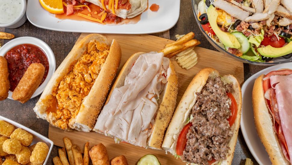 Our Deli & Cafe dishes on tabletop.