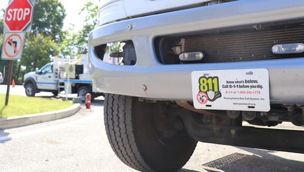 Truck with license plate that urges people to call 811 before digging.