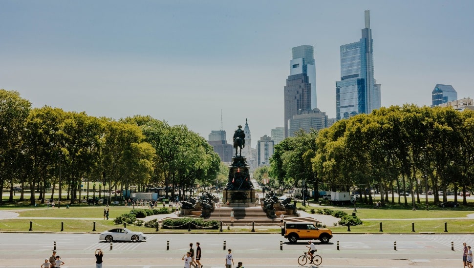 People walking and standing near the Philadelphia Museum of Art.