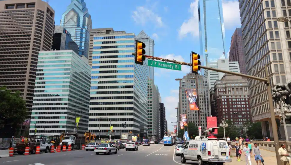 Cars and pedestrians in traffic in Philadelphia.
