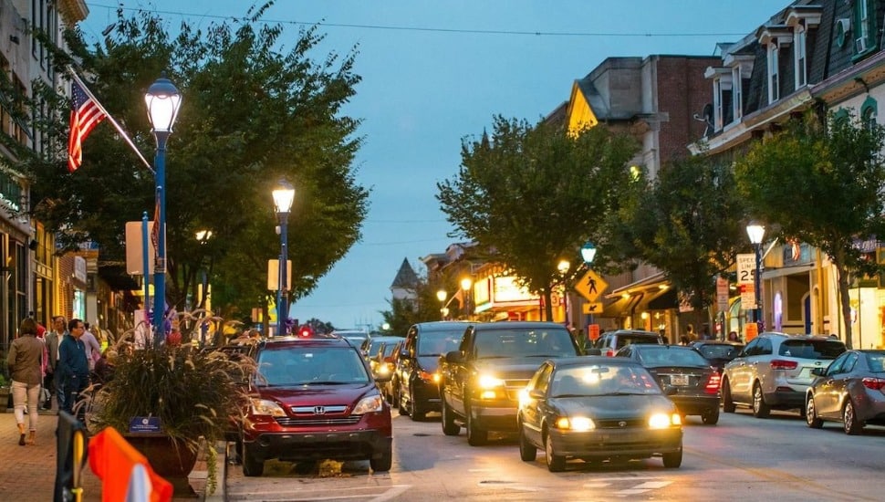 Several cars and buildings in downtown Phoenixville.