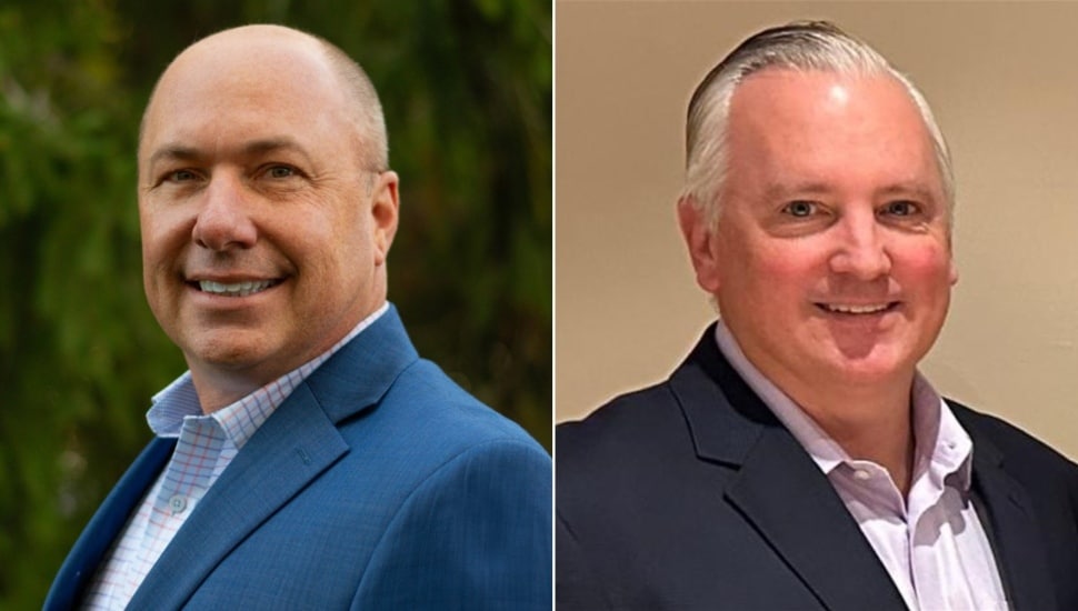 Two headshots of middle-aged men in blue suits with open collars.