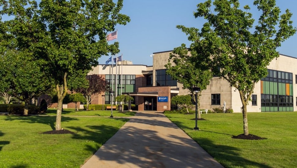 Walkway leads to building on college campus.