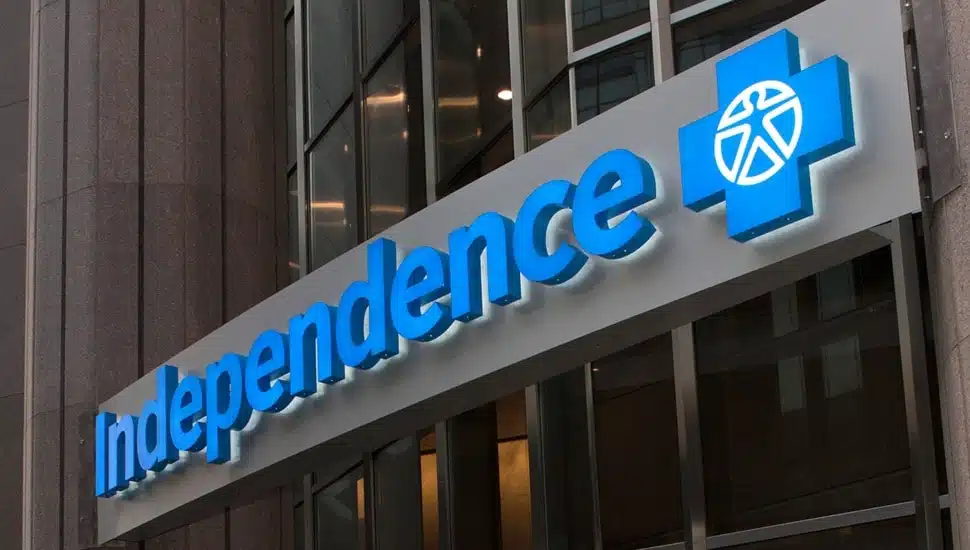 Health insurance company's blue signage on building.