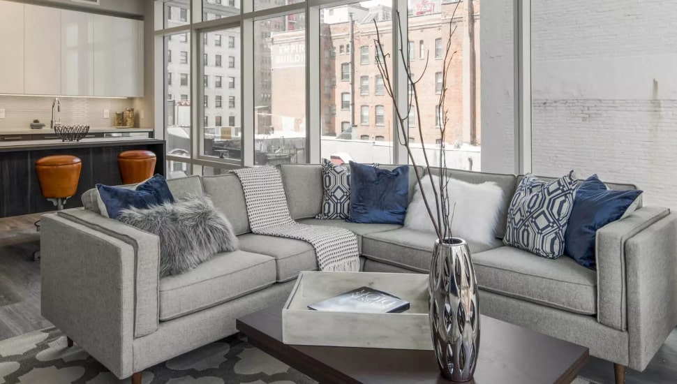 Living room and kitchen of a Philadelphia apartment inside 1213 Walnut Street.