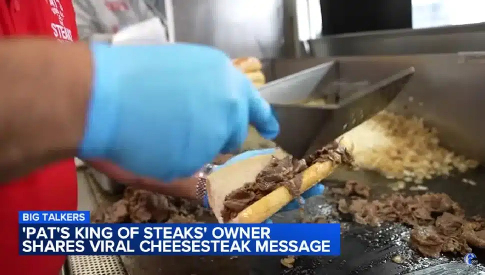 Frank Olivieri making a cheesesteak.