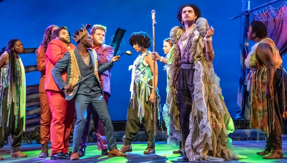 People on stage during a theatre production.
