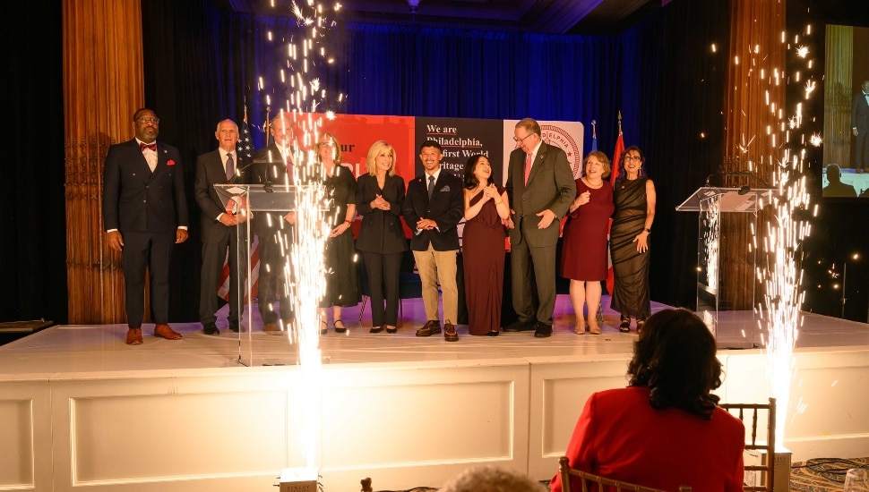 Speakers and honorees on stage.